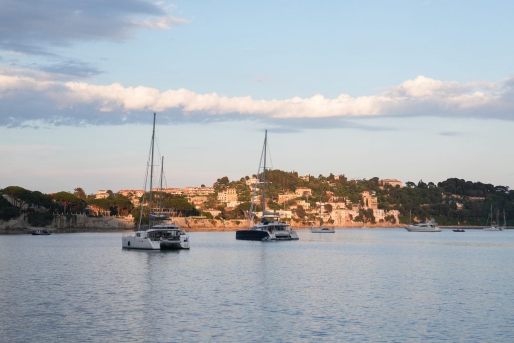 Catamarans and yachts anchored off the Villefranche-sur-Mer coast