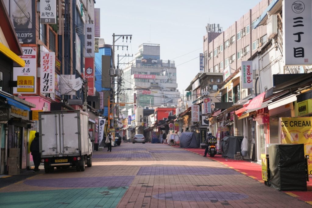 Shop-lined pedestrian street in Seoul's Hongdae neighborhood