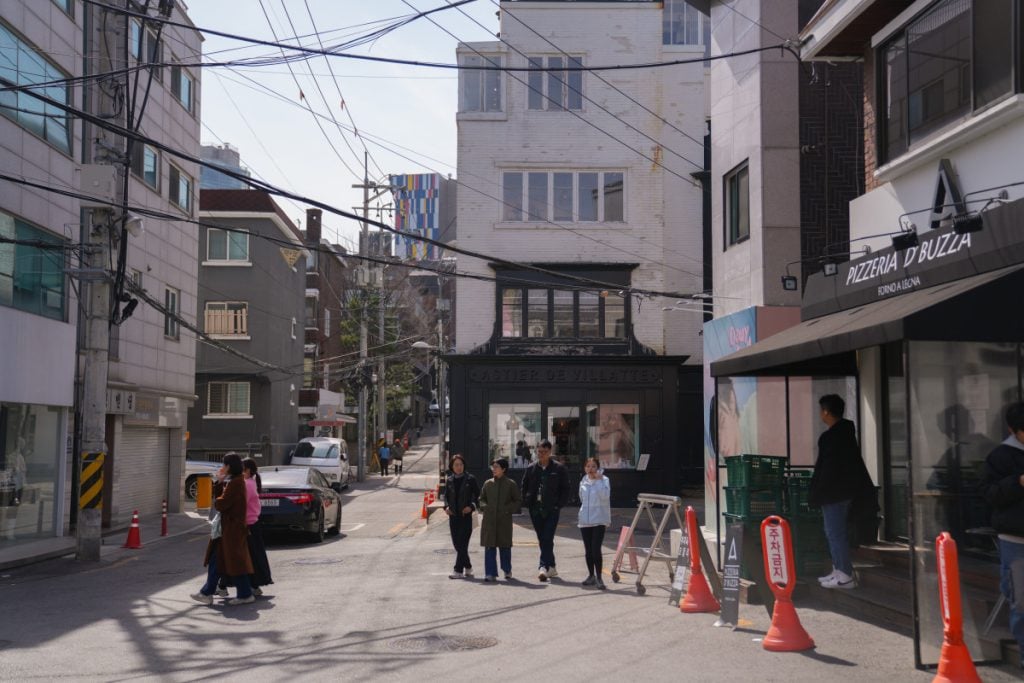 Pedestrians on a neighborhood street in Itaewon