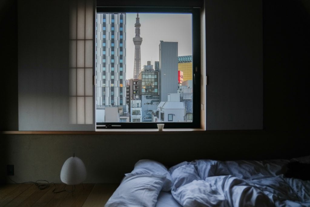 Japanese-style tatami room with sliding shoji doors at a ryokan in Tokyo