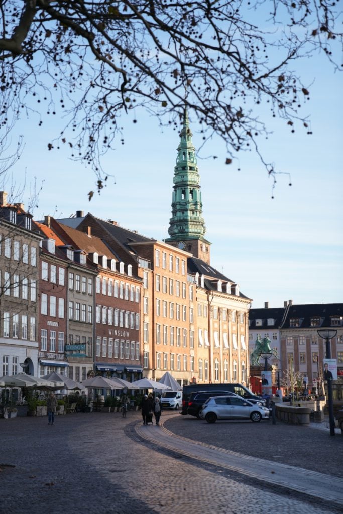 Colorful buildings and a church tower in central Copenhagen