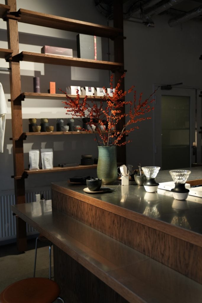 Coffee bar and ceramics display at Coffee Collective