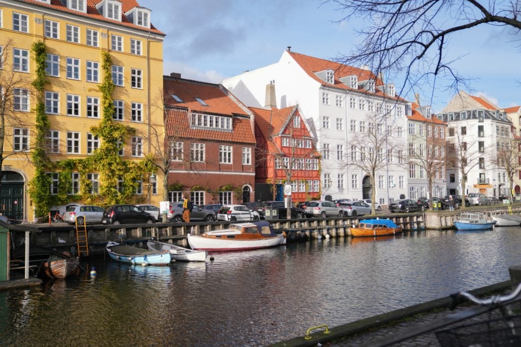 Colorful canal houses and moored boats in Christianshavn