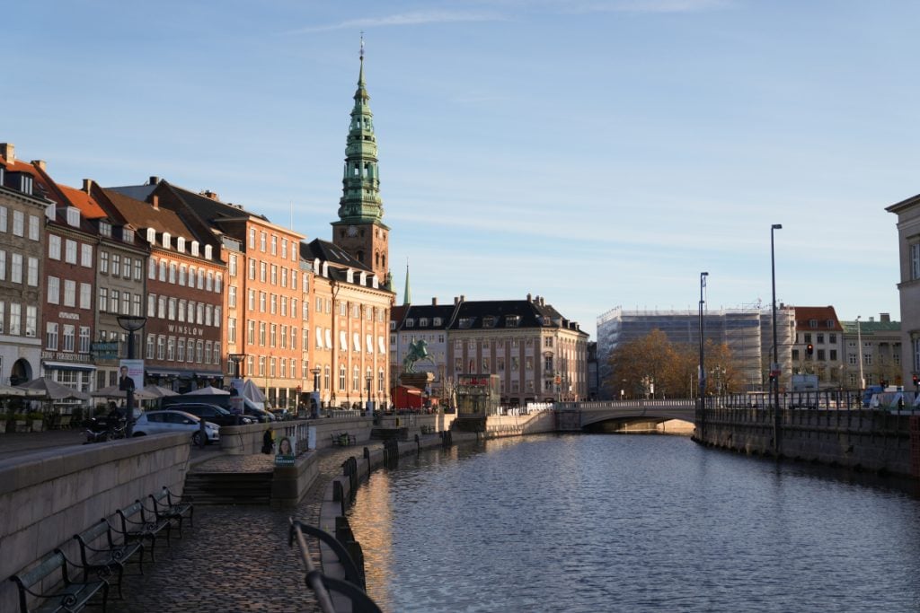 Copenhagen canal lined with historic buildings at dusk