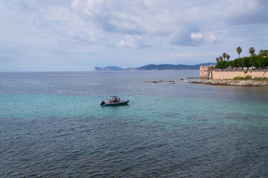 Sailing along the Riviera del Corallo near Alghero, Sardinia