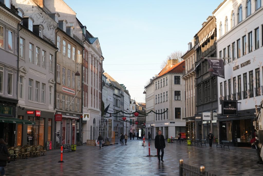 Shops and pedestrians along Strøget in Copenhagen