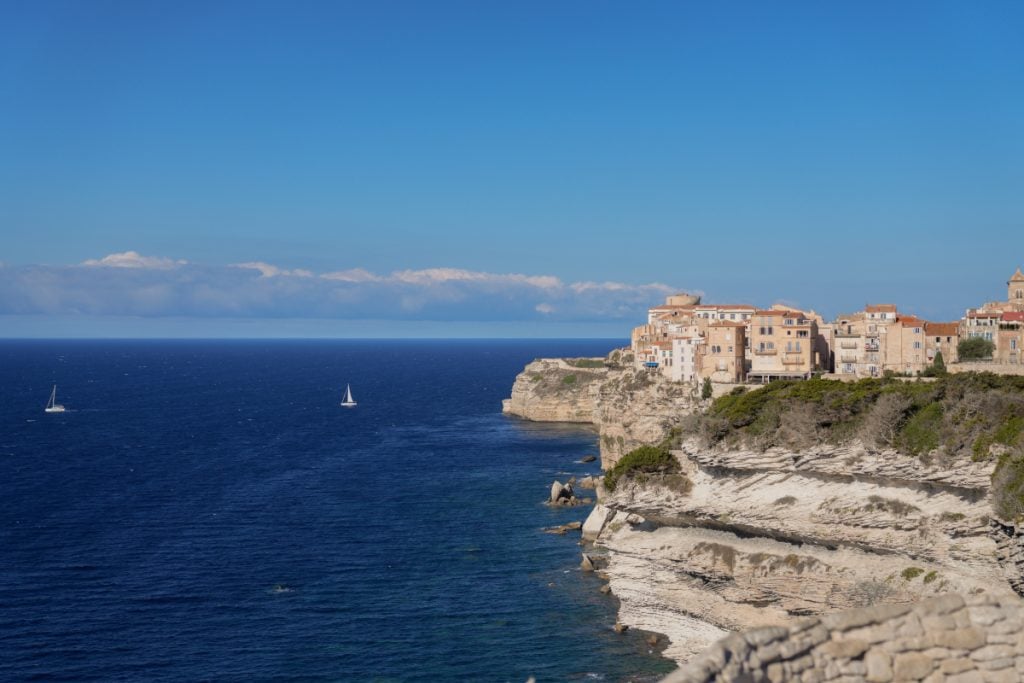 Panoramic view of Bonifacio's citadel and cliffs from across the harbor
