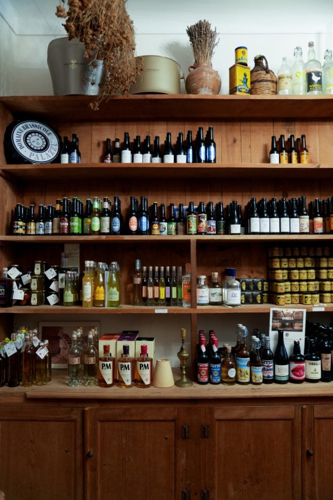 Wine bottles and preserved goods on display at L'antigu in Bonifacio
