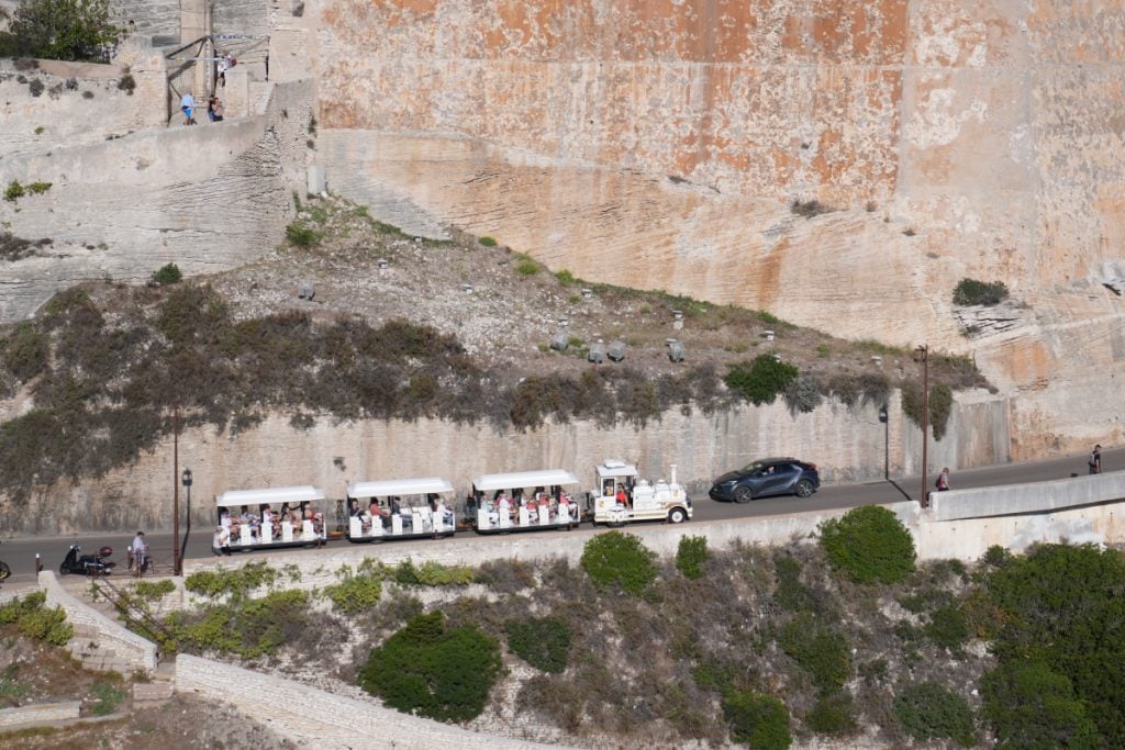 Small tourist train running between the port and the citadel in Bonifacio