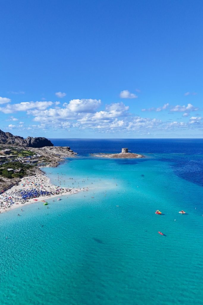 Looking out over the clear turquoise water at La Pelosa, Sardinia