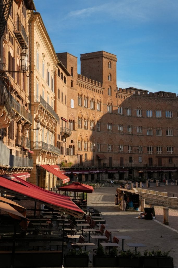 Outdoor café tables in Siena’s Piazza del Campo