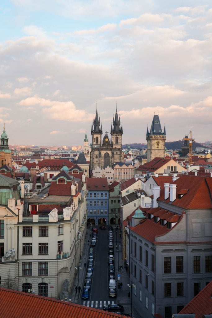 Church spires and red rooftops in Prague's Old Town