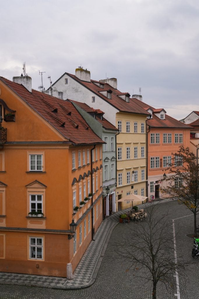 Colorful historic townhouses on a cobblestone Malá Strana street