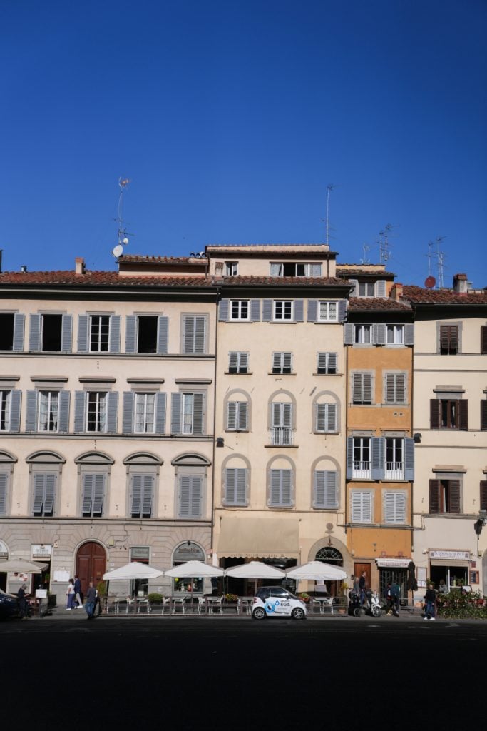 Shuttered building facades in Florence's Oltrarno neighborhood
