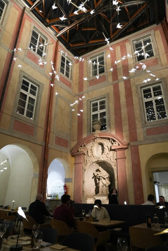 Church-like atrium dining room at 420 restaurant in Prague