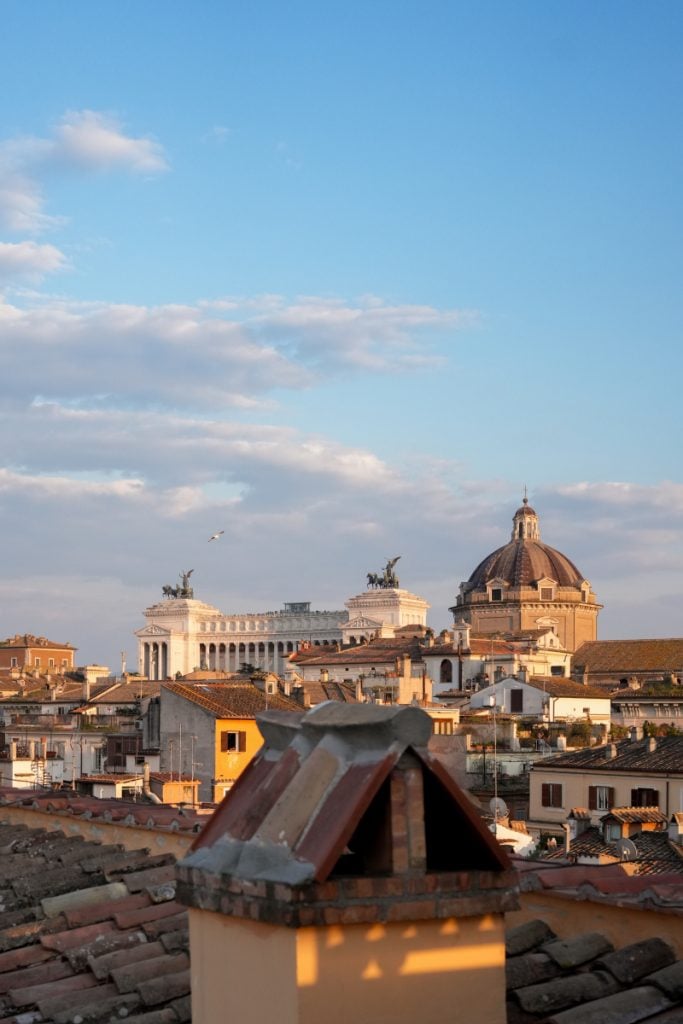 Rome rooftops with the Vittoriano and a church dome