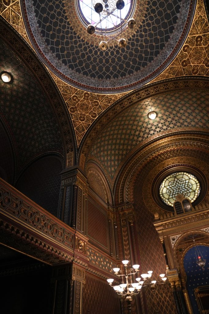 Ornate blue-and-gold domed interior of the Spanish Synagogue