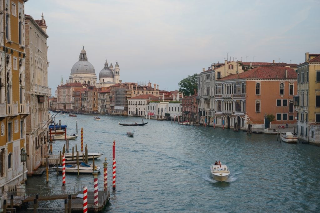 Grand Canal with gondola and historic buildings in Venice