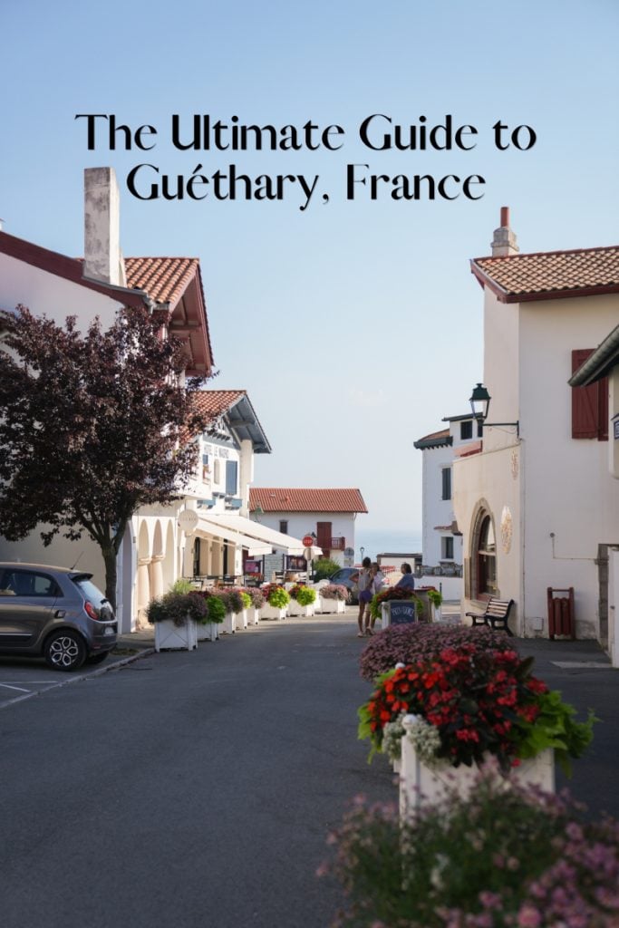 Pinterest graphic for a Guéthary guide over a flower-lined street