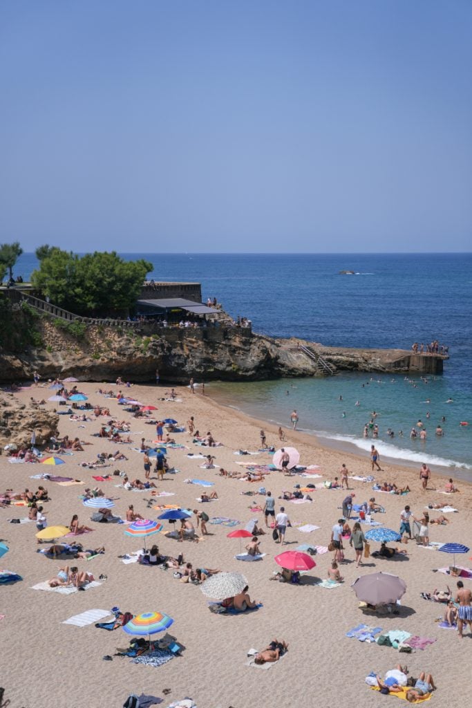Beachgoers at Plage du Port Vieux in Biarritz