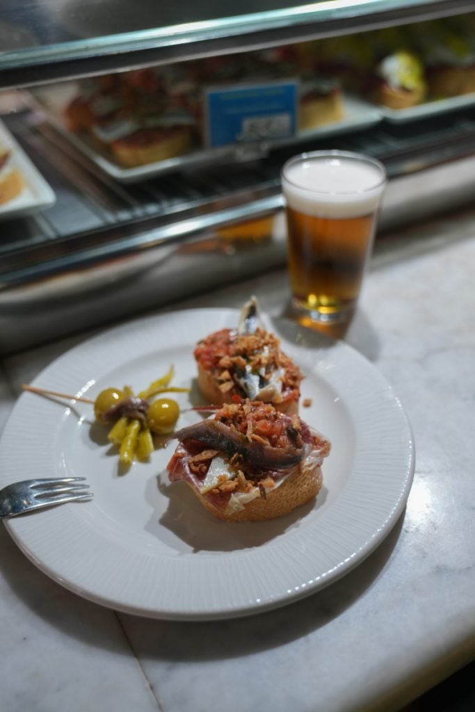 Anchovy pintxos, olives, and beer at Café Bar Bilbao