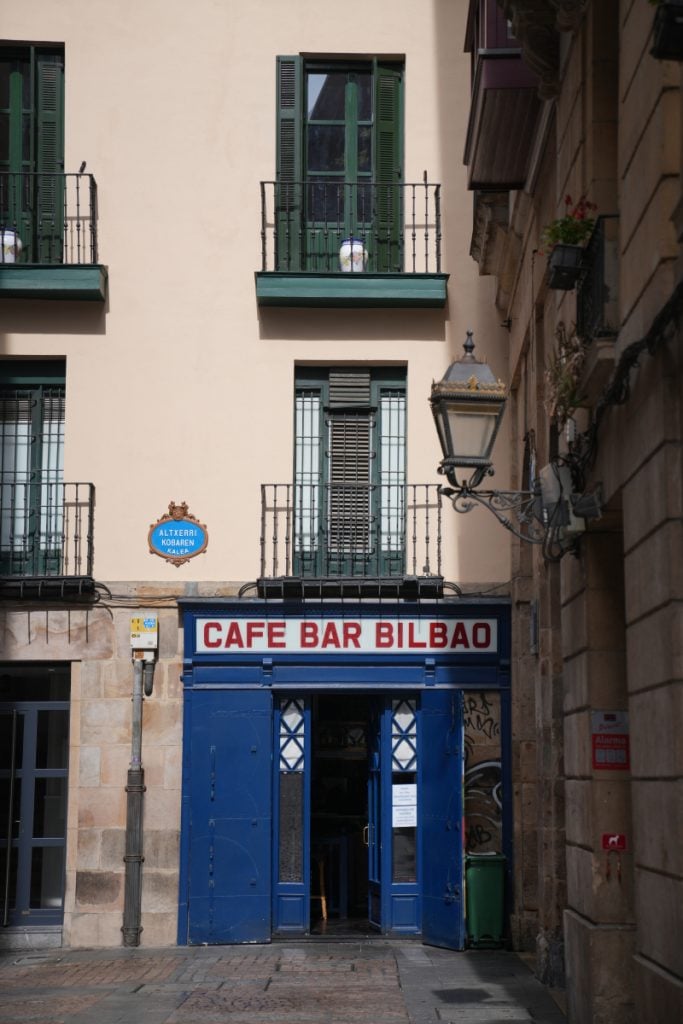 Blue storefront of Cafe Bar Bilbao