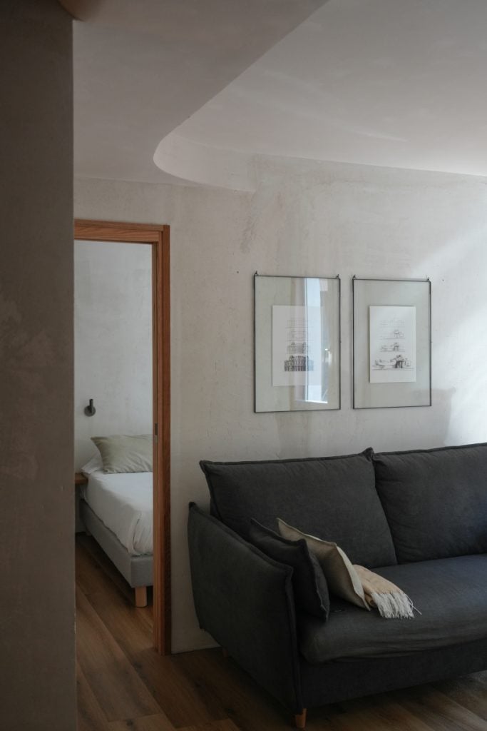 Sofa and bedroom at Enea Living in Bilbao