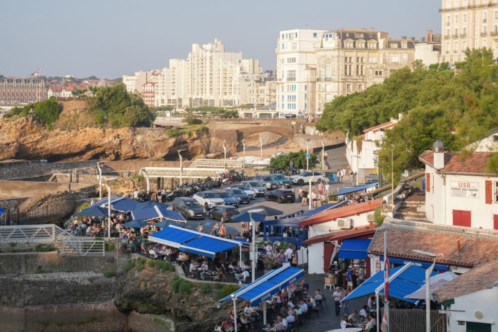Busy restaurant terraces at Port des Pêcheurs in Biarritz