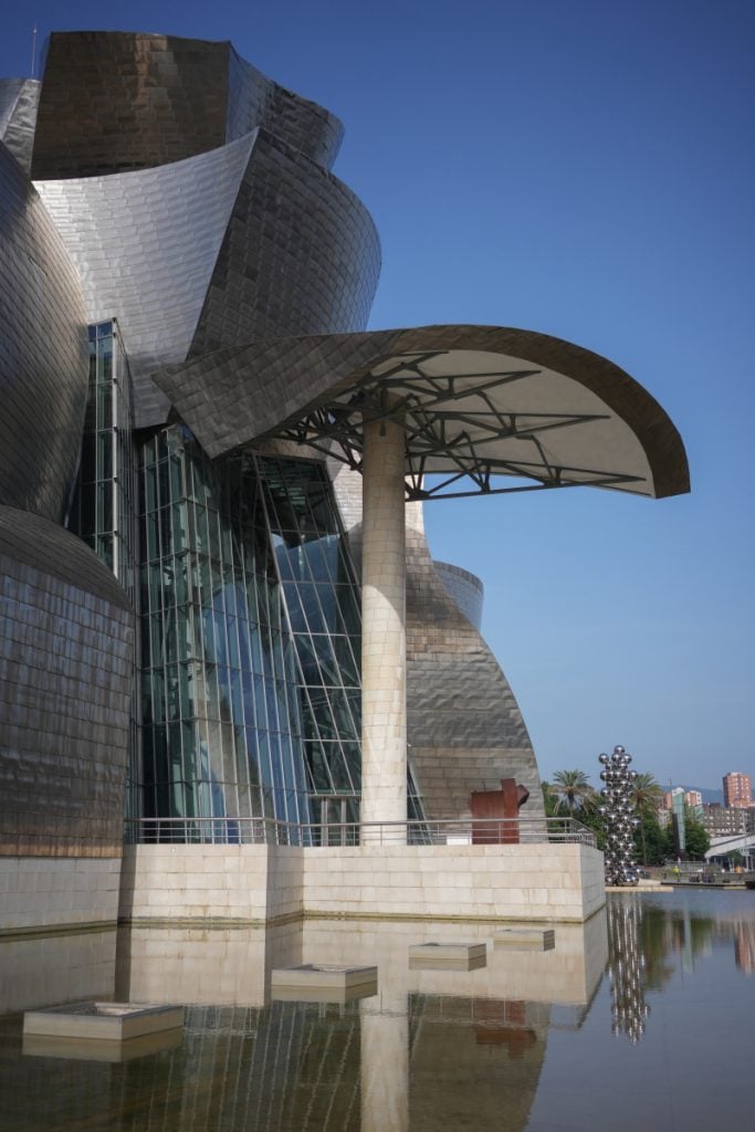Guggenheim Museum Bilbao exterior reflected in a pool