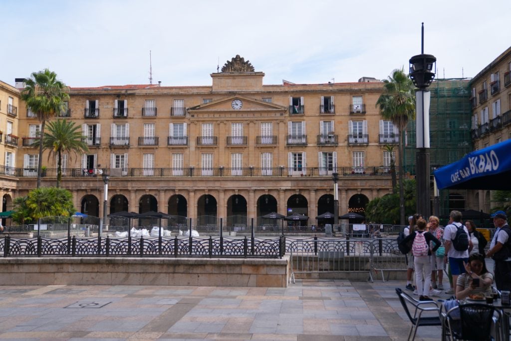 Arcaded facade and café seating in Plaza Nueva