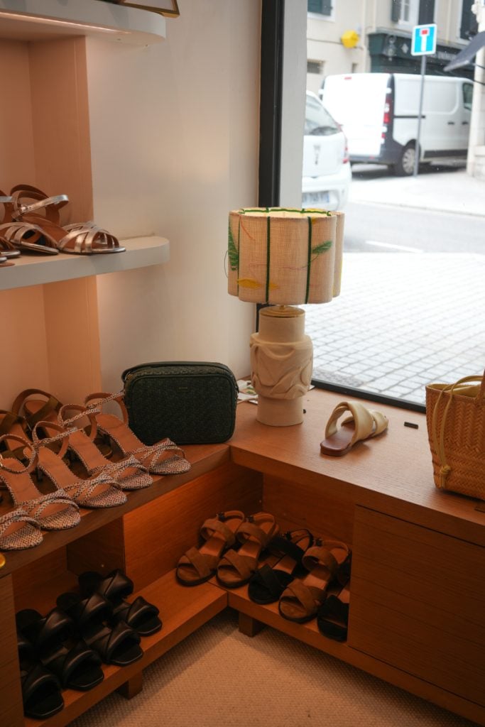 Sandals displayed inside Anthology boutique in Biarritz