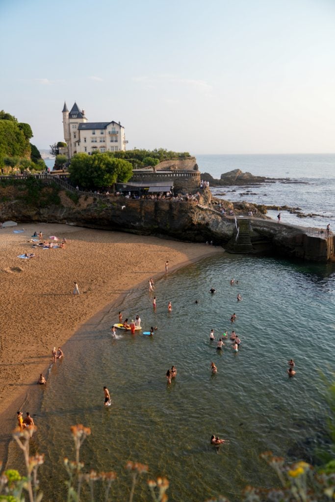 Swimmers at a sheltered beach cove in Biarritz