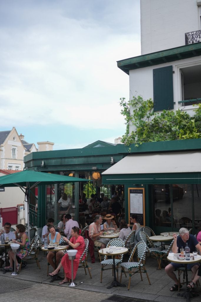 Diners at a busy brasserie terrace in Biarritz