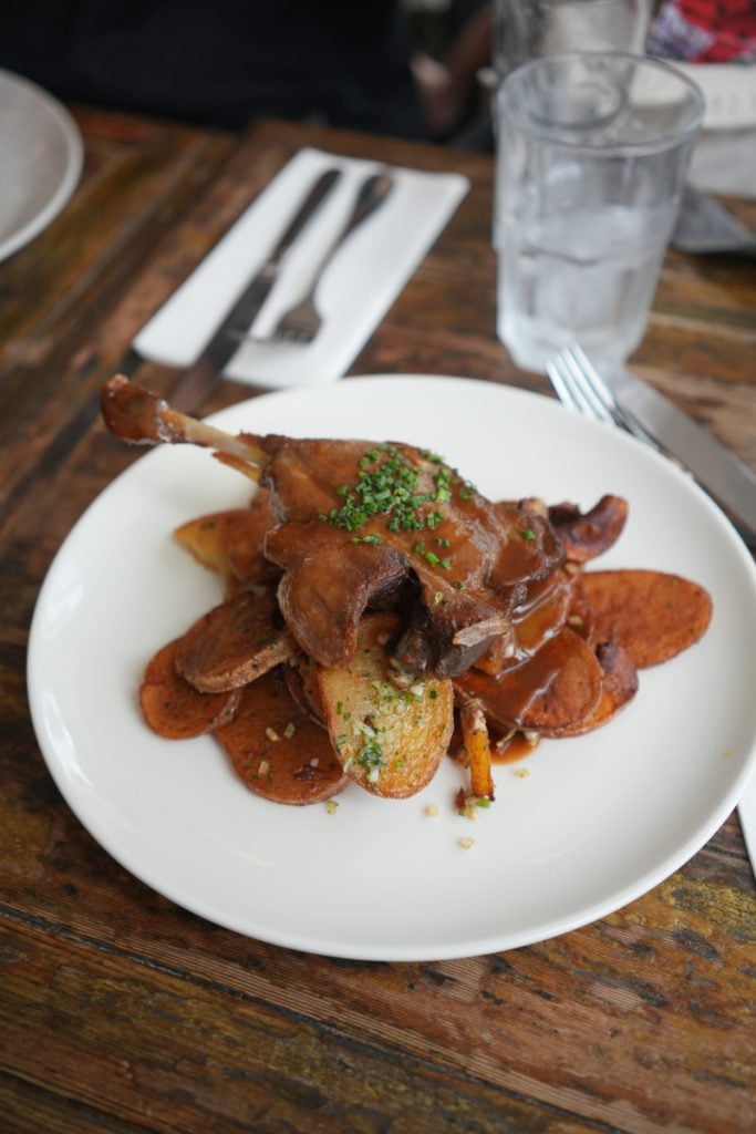 Duck leg with roasted potatoes at Le Café du Commerce