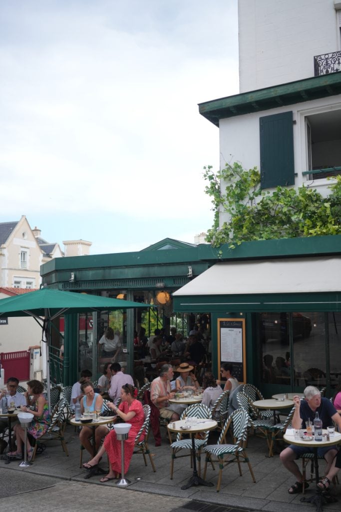 Diners on the outdoor terrace at Le Café du Commerce