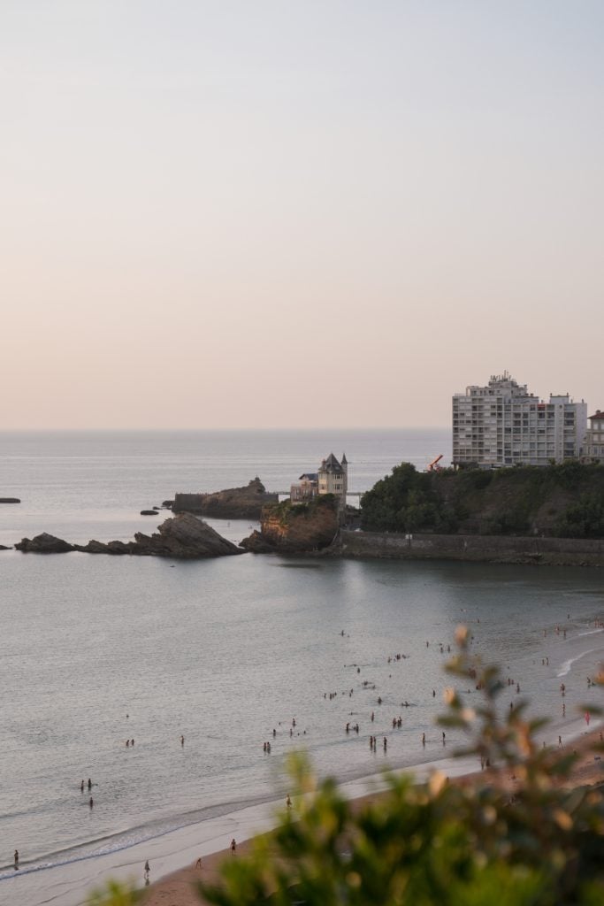 Swimmers off Plage de la Côte des Basques at dusk