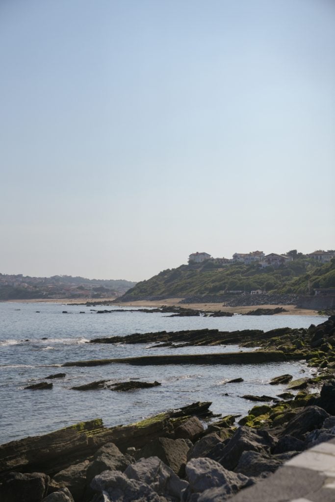 Rocky shoreline and beach along the Guéthary coast