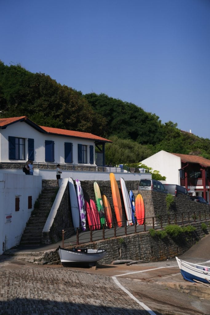 Colorful surfboards lined up at Guéthary Port