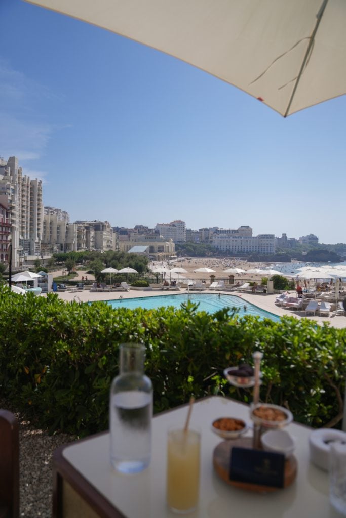 Drinks overlooking the pool and beach at Hôtel du Palais
