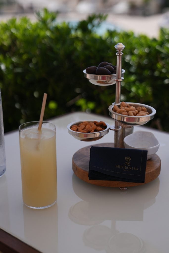 Drink and nuts on the Hôtel du Palais terrace