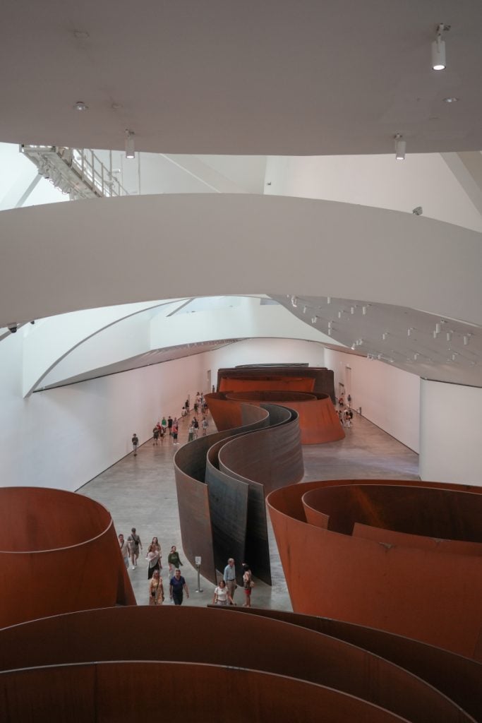 Visitors explore Richard Serra’s steel installation at Guggenheim Bilbao
