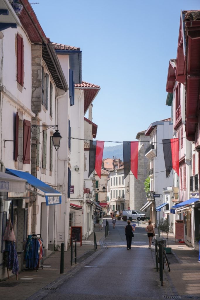Red and black banners over a Saint-Jean-de-Luz street