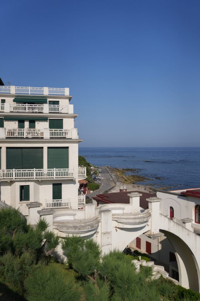 Coastal buildings and ocean viewed from Terrasse Pierre-Lious