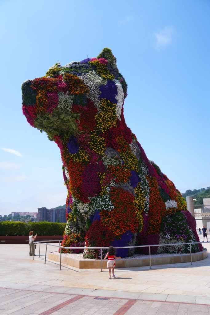 Flower-covered Puppy sculpture outside the Guggenheim Museum Bilbao