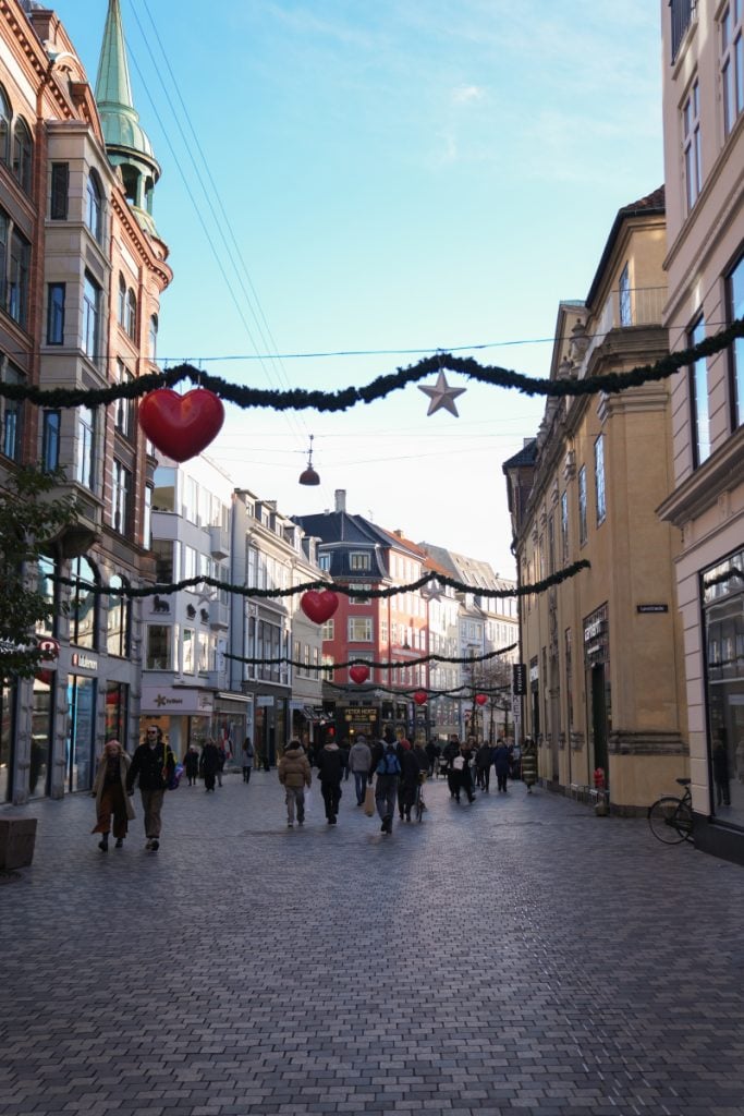 Copenhagen pedestrian street with hanging Christmas garlands