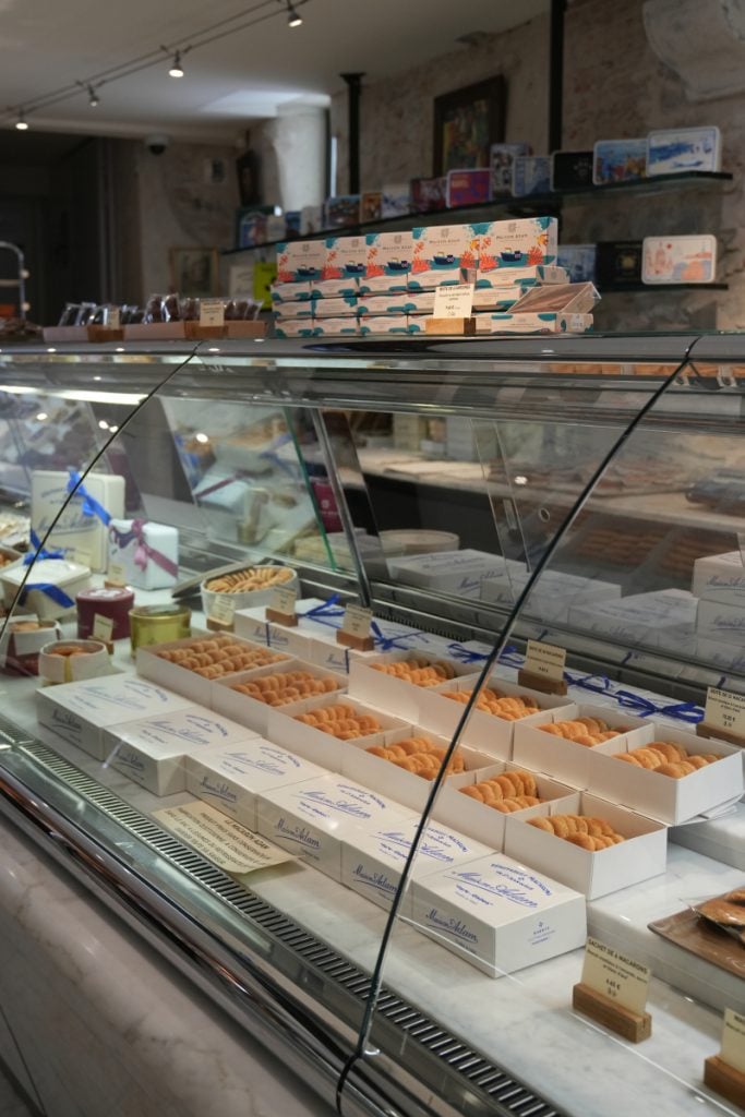 Macaron display case inside Maison Adam