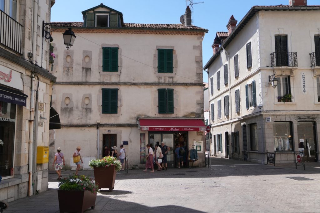 Pedestrians cross a square in Saint-Jean-de-Luz Old Town