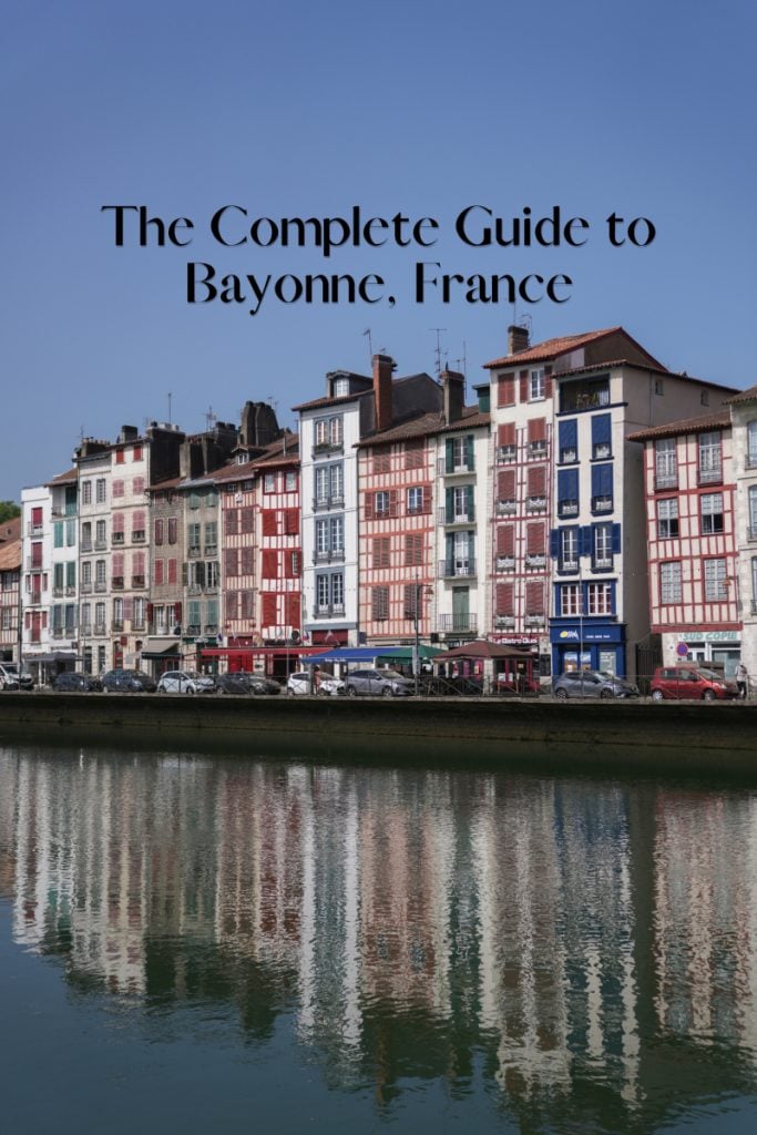 Bayonne travel guide graphic with riverside buildings