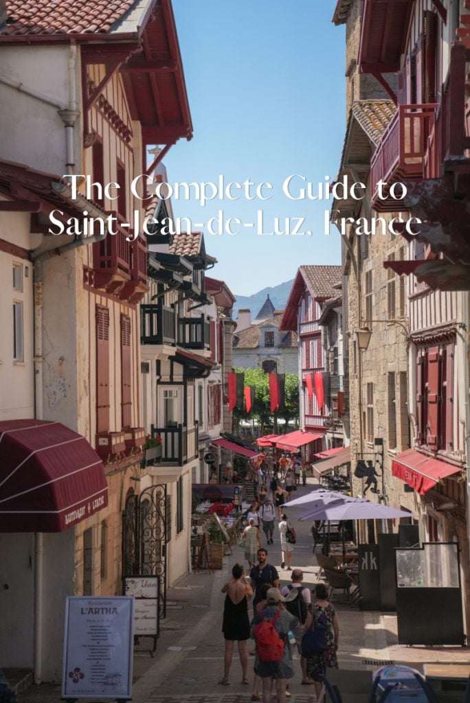 Pinterest graphic of pedestrians on a Saint-Jean-de-Luz street