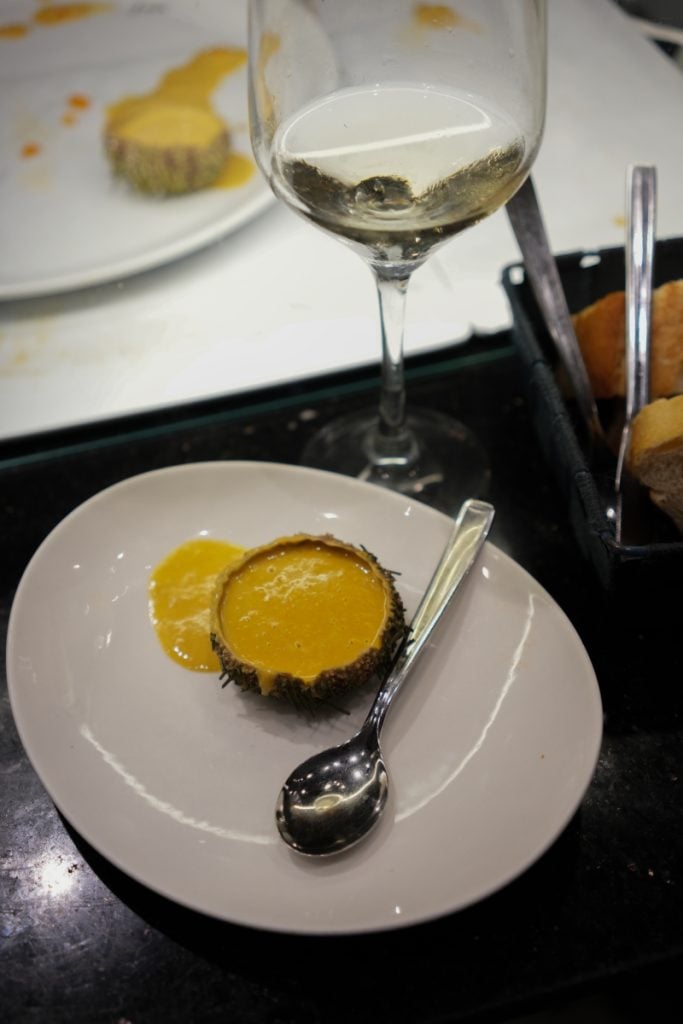 Sea urchin pintxo and white wine at Bar Sport
